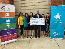 Sharonview delivers check the the Hispanic Alliance of South Carolina
