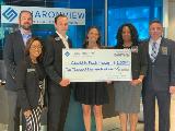 Sharonview delivers check to Charlotte Family Housing