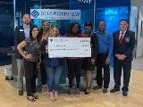Sharonview delivers check to NC MedAssist