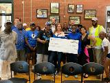 Sharonview delivers check to RunningWorks