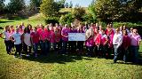 Sharonview employees wear pink and gather together to present check for Susan G Komen foundation.