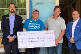 Sharonview delivers check to Habitat for Humanity