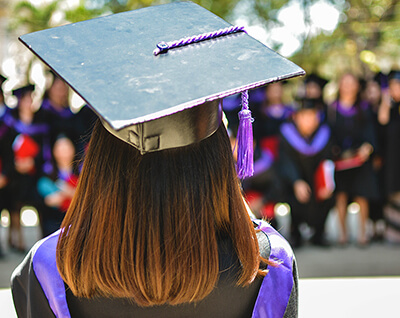 Graduating student looking out among peers