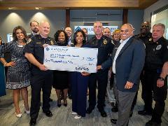 image of City of Simpsonville Victim Advocate receiving check from Sharonview